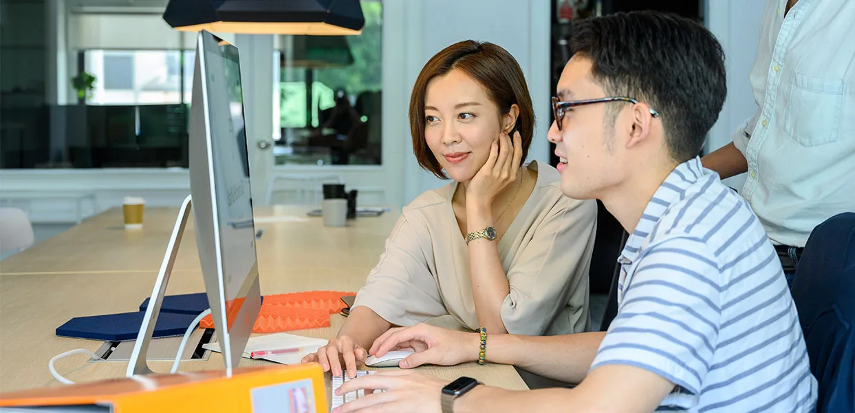 Man and woman watching computer services-1